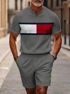 Men's two-piece set featuring a short-sleeved, half-zip polo top with a small stand-up collar and printed pattern, paired with shorts.